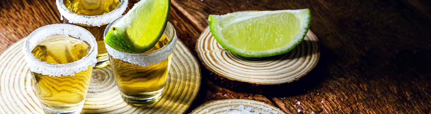 Tequila shot glasses with lime